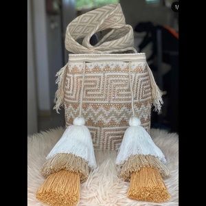 Multicolor shiny bag handmade using a unique technique and a special thread .